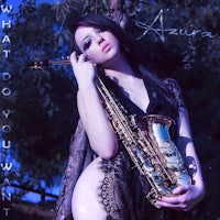 a woman holding a saxophone