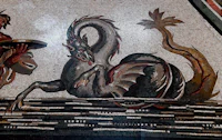 a mosaic depicting a man and a dragon