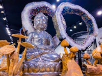 a statue of a buddha in a museum